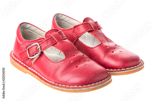 Red children leather shoes for girls isolated on white background