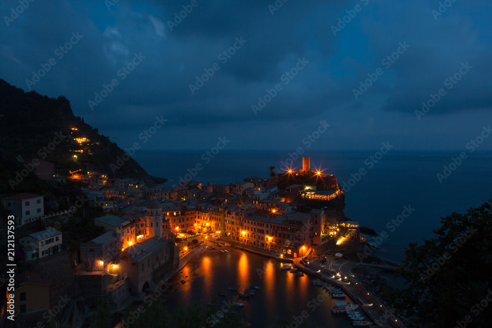 Nightime view of the beautiful seaside of Vernazza village in summer in the Cinque Terre area, Italy