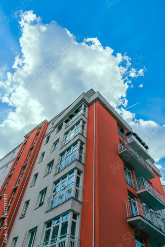 building facade blue sky with white clouds on background