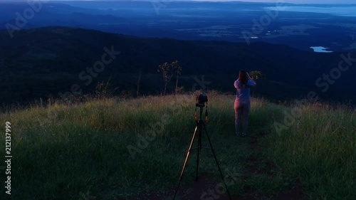 Wallpaper Mural Flying from unrecognizable girl watching the mountains with binoculars and camera on the tripod. Torontodigital.ca