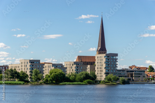 view over the river warnow - skyline of Rostock with Petri church in the background 