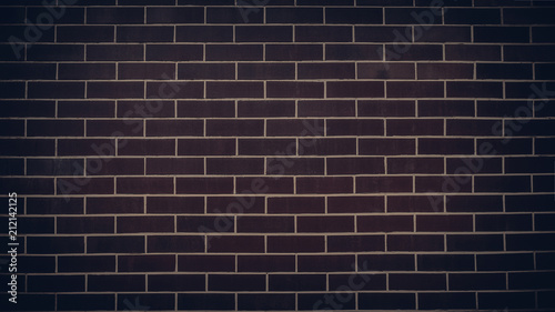Dark brick wall with light mortar. Texture background