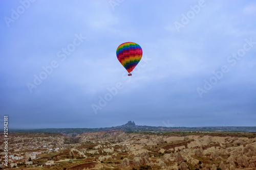 Large balloons fly over the mountains in Cappadocia in Turkey. Flight in a balloon between Europe and Asia. Fulfillment of desires. Extreme. Colorful balloon in the sky above the mountains, picturesqu
