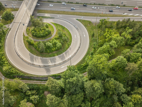 Aerial view of round circle road connecting a highway