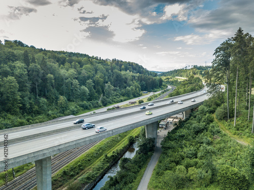  Aerial view of highway bridge in forest in Switzerland, Europe