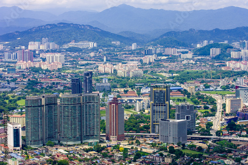 Kuala Lumpur city skyline with mountains and skyscrapers, Malaysia