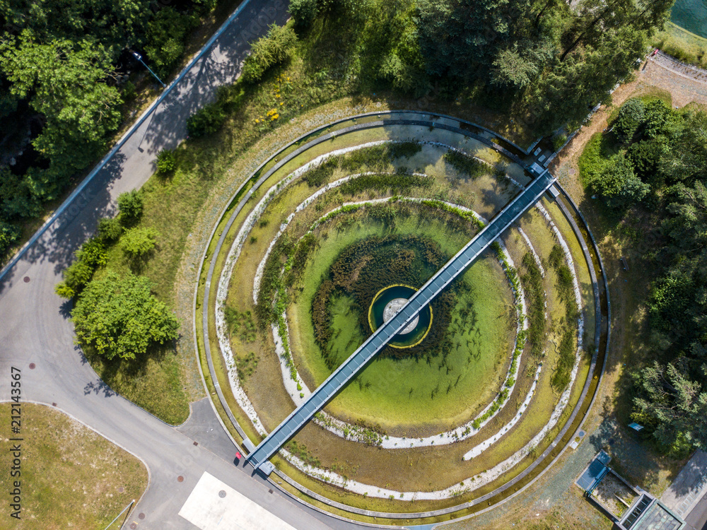 Aerial view of circular round park structure between trees