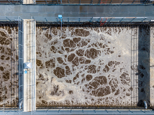 Aerial view of wastewater treatment plant with water pools in Europe