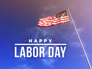Happy Labor Day Text Over American Flag Blowing in the Wind