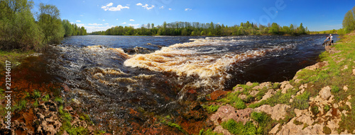 Spring panorama with a lazy river and rapids