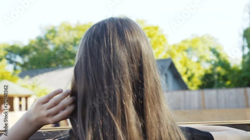 The young girl comes to rosturm, looks on arena and smiles at camera photo