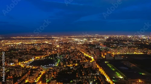 The camera moving up on the night city landscape background. time lapse