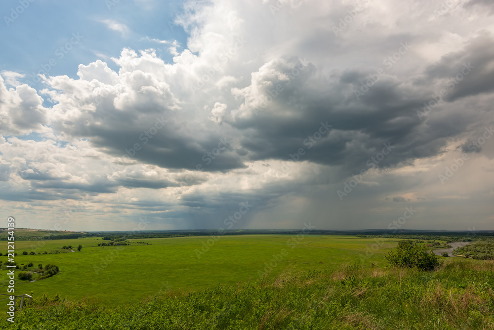 Strong wind drove the rain clouds and filled the entire space to the horizon and is noticeable, as in some places it is already raining heavily Strong wind drove the rain clouds and filled the entire space to the horizon and is noticeable, as in some places it is already raining heavily
