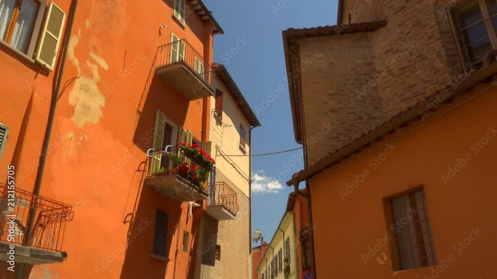 flowers in windows of ancient buildings in medieval village flowers in windows of ancient buildings in medieval village
