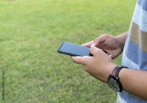 Hands using mobile phone