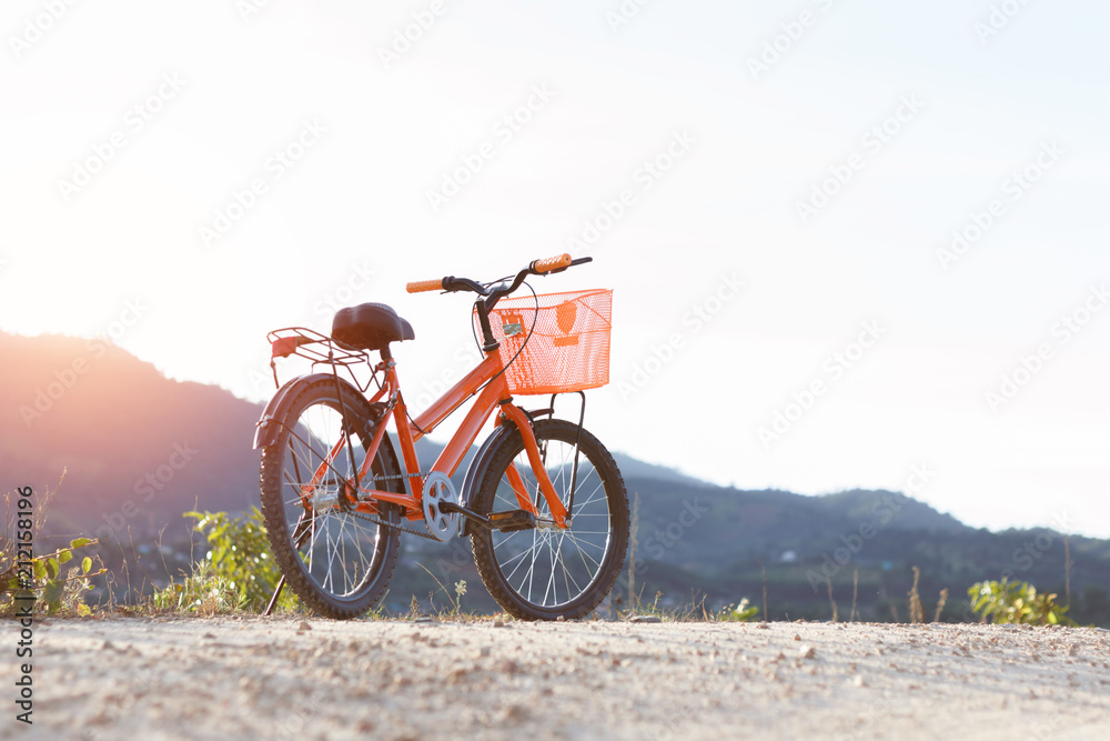 Fototapeta premium bike on mountain at sunset time