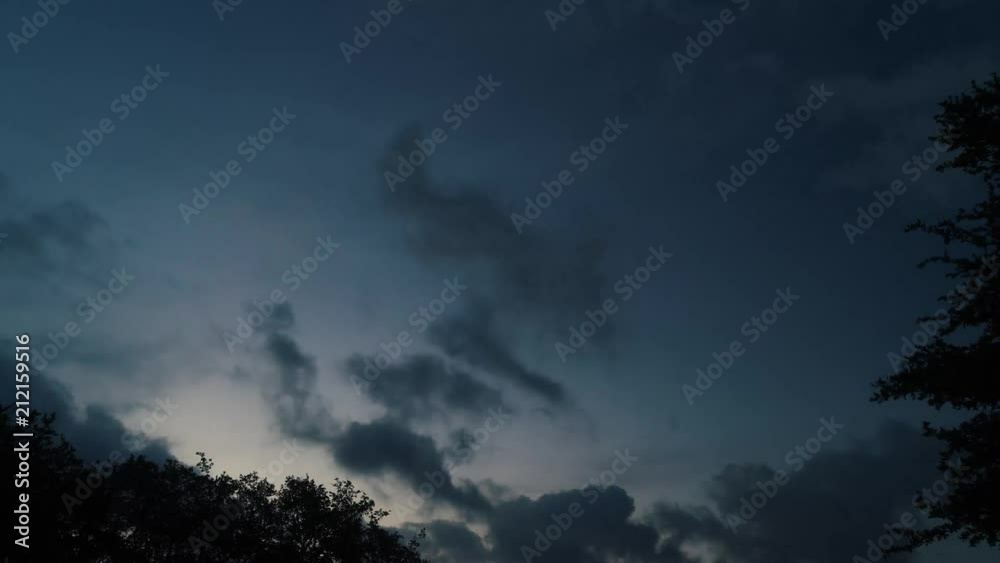 Early morning cloud time lapse of clouds with a small moon. Early morning cloud time lapse of clouds with a small moon.