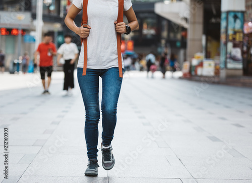 young woman walking in modern city