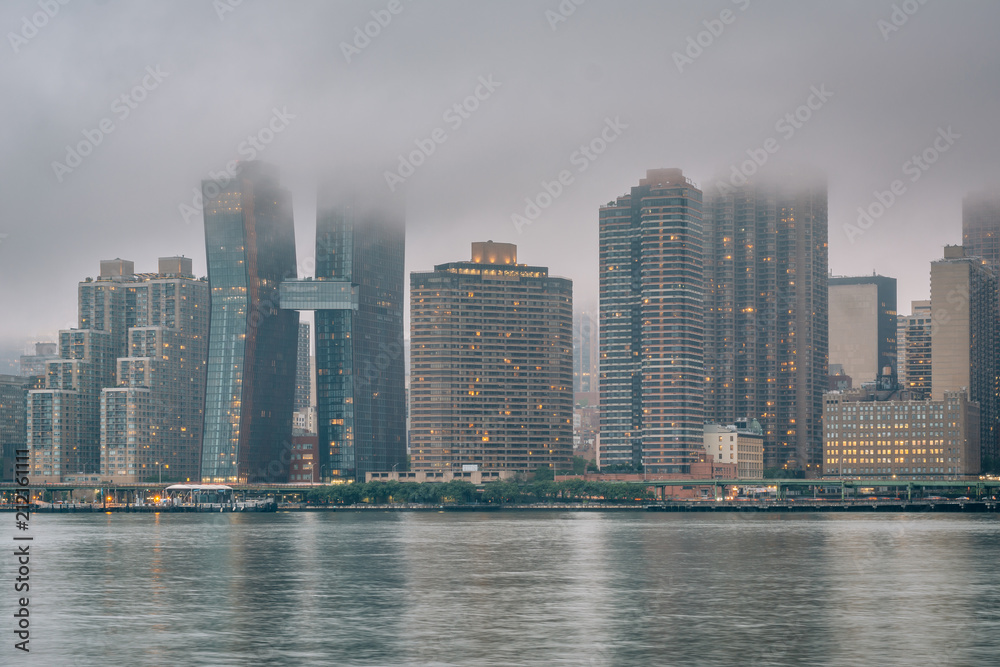 Foggy view of the Manhattan skyline from Gantry Plaza State Park, in Long Island City, Queens, New York City. Foggy view of the Manhattan skyline from Gantry Plaza State Park, in Long Island City, Queens, New York City.