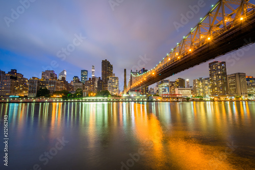 The Queensboro Bridge at night  seen from Roosevelt Island in New York City.