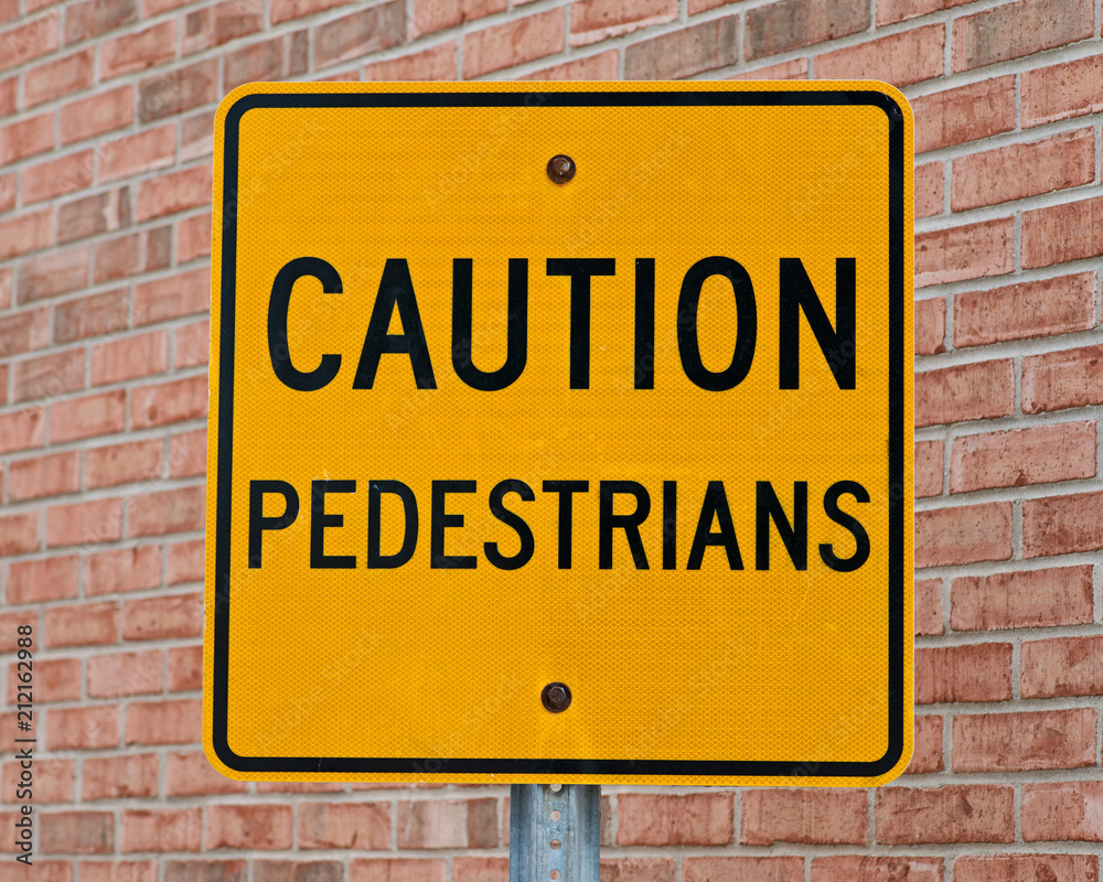 Caution Pedestrians warning traffic sign in US