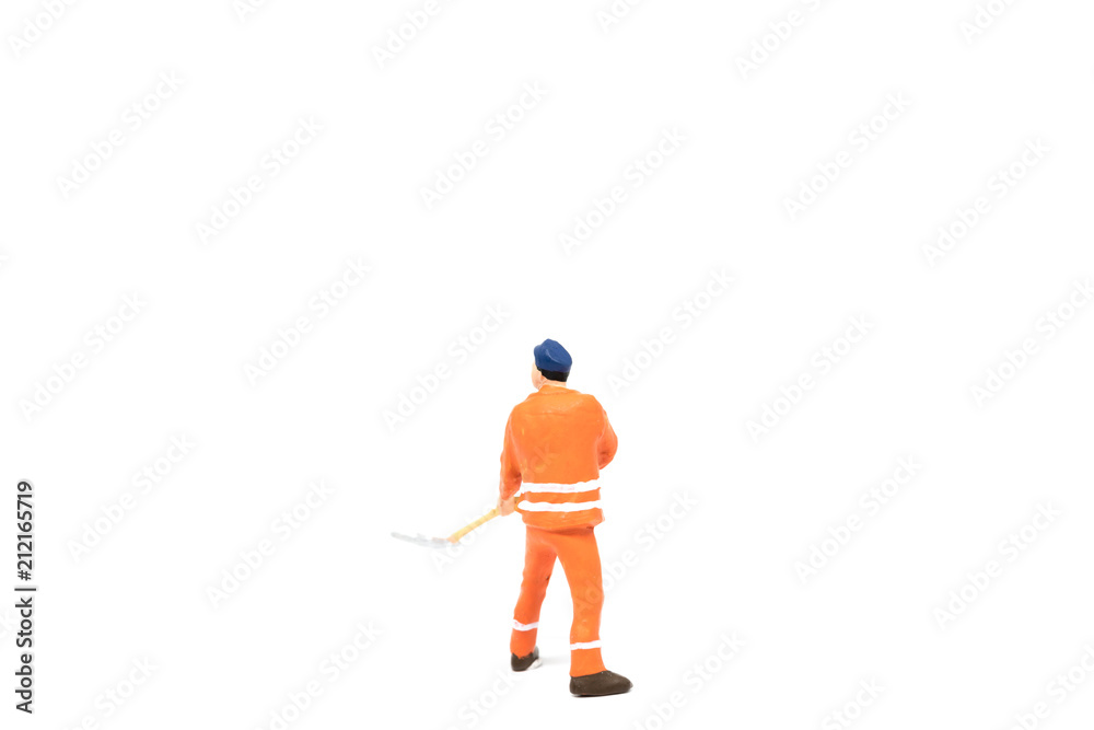 Miniature people worker wearing safety construction on white background with a space for text