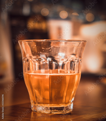 Fototapeta Naklejka Na Ścianę i Meble -  Alcoholic beverage on a wooden table in a pub. (vintage tone)