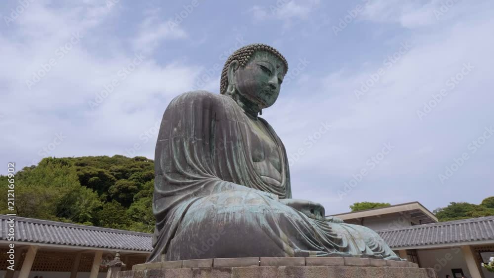Most famous landmark in Kamakura - The Great Buddha Daibutsu - TOKYO / JAPAN - JUNE 12, 2018 Most famous landmark in Kamakura - The Great Buddha Daibutsu - TOKYO / JAPAN - JUNE 12, 2018