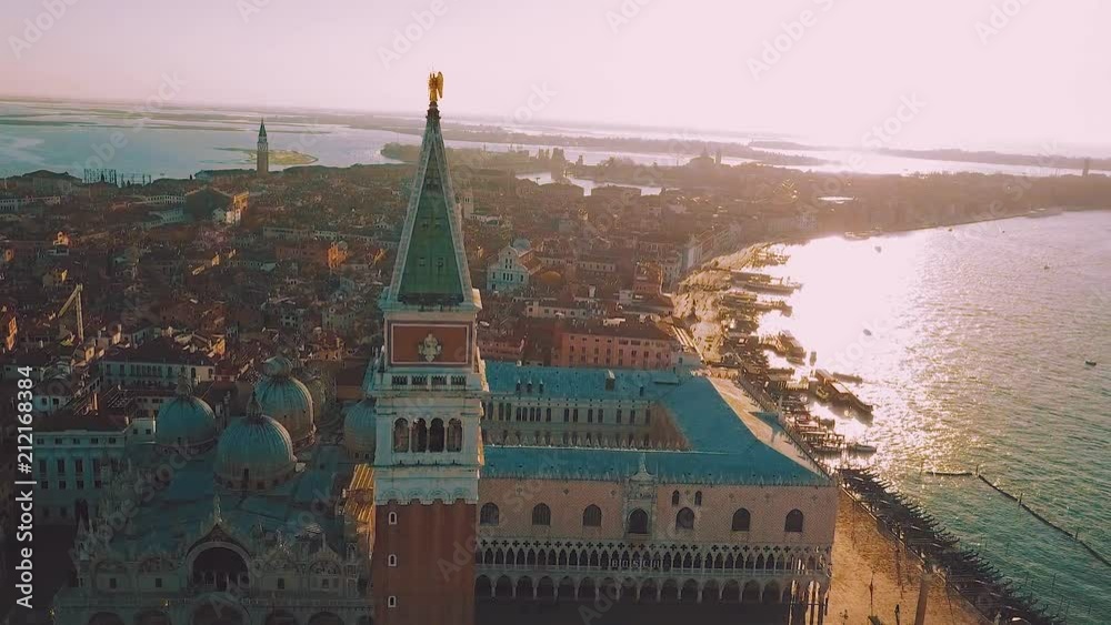 aerial orbit over san marco square at sunrise in venice italy