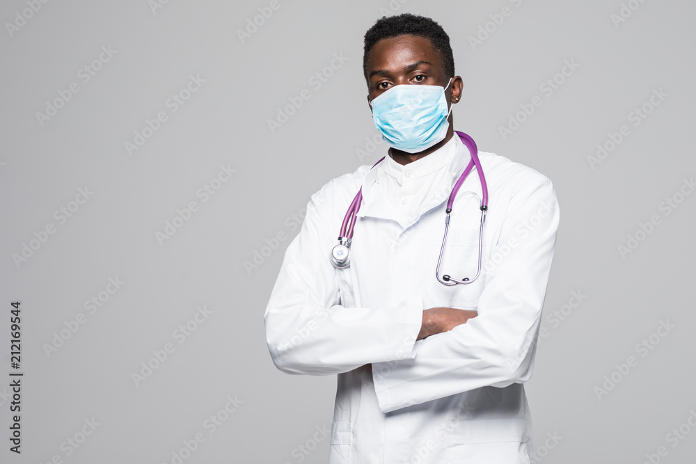 African-American medical doctor man with mask isolated on gray background