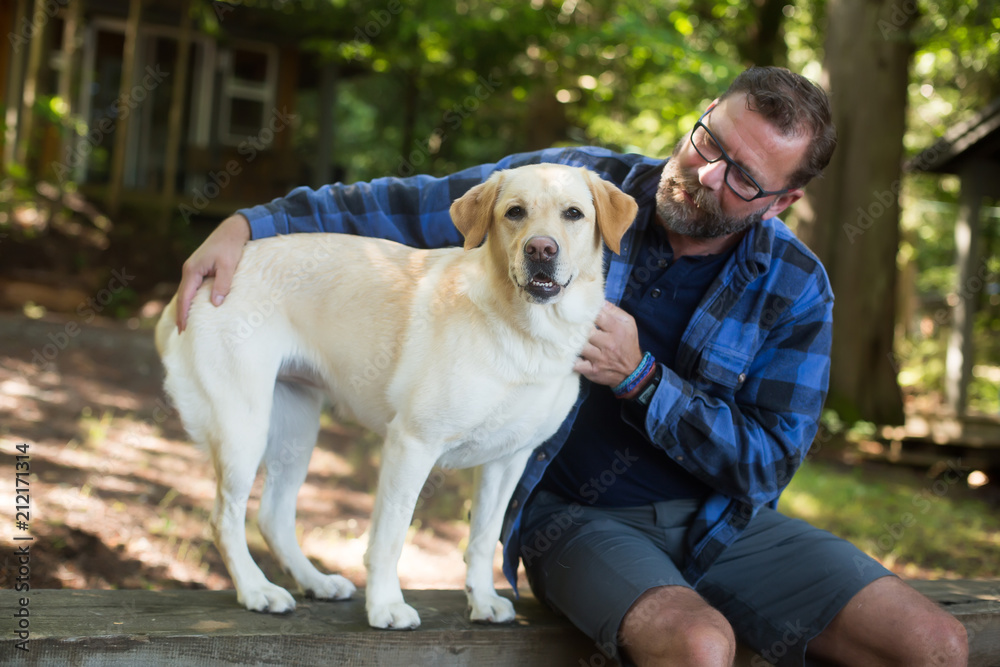 Man and yellow lab dog camping Man and yellow lab dog camping