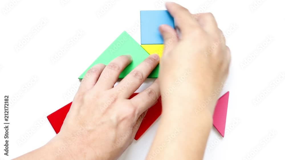 Man complete tangram puzzle in home shape on white background (Concept from dream home, happy family, mortgage loan)
