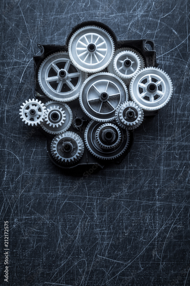 gears on a scratched gray background gears on a scratched gray background