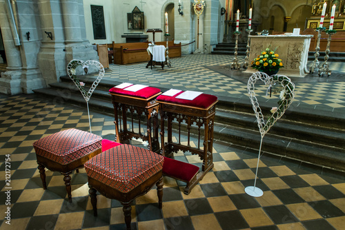 Wedding arrangement chairs inside The Basilica of St. Castor oldest church in Koblenz German state Rhineland Palatinate photo