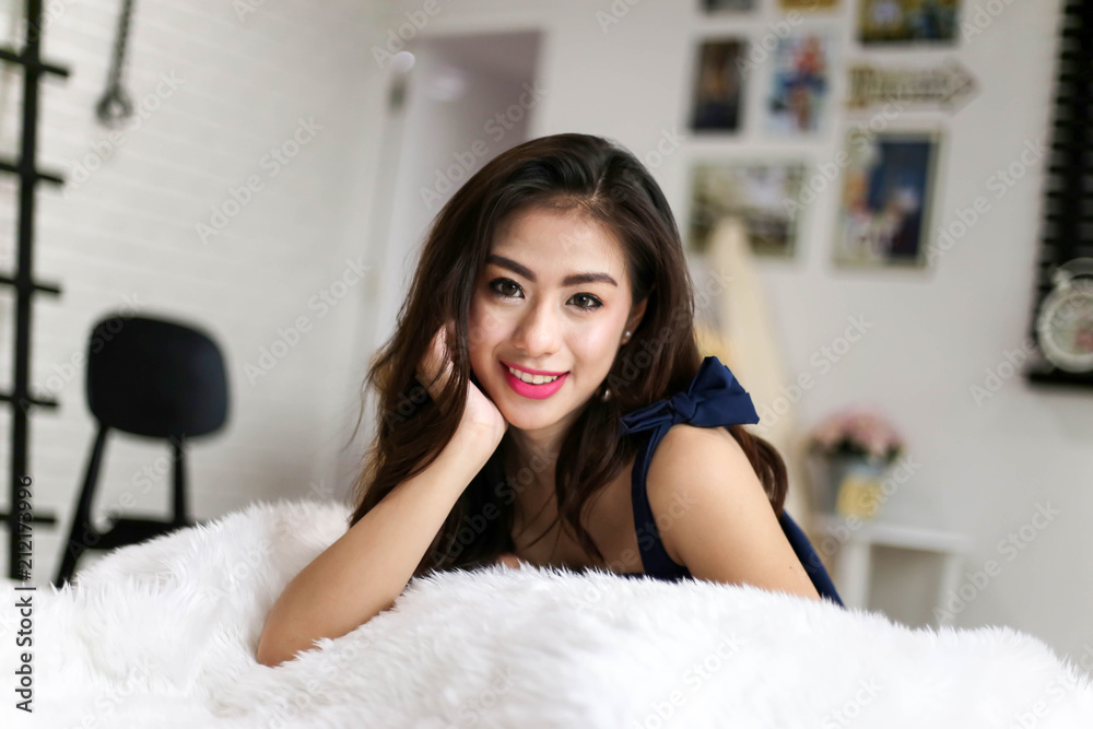 Beautiful Charming woman Smile face close up and she lying on the bed in the morning Beautiful Charming woman Smile face close up and she lying on the bed in the morning