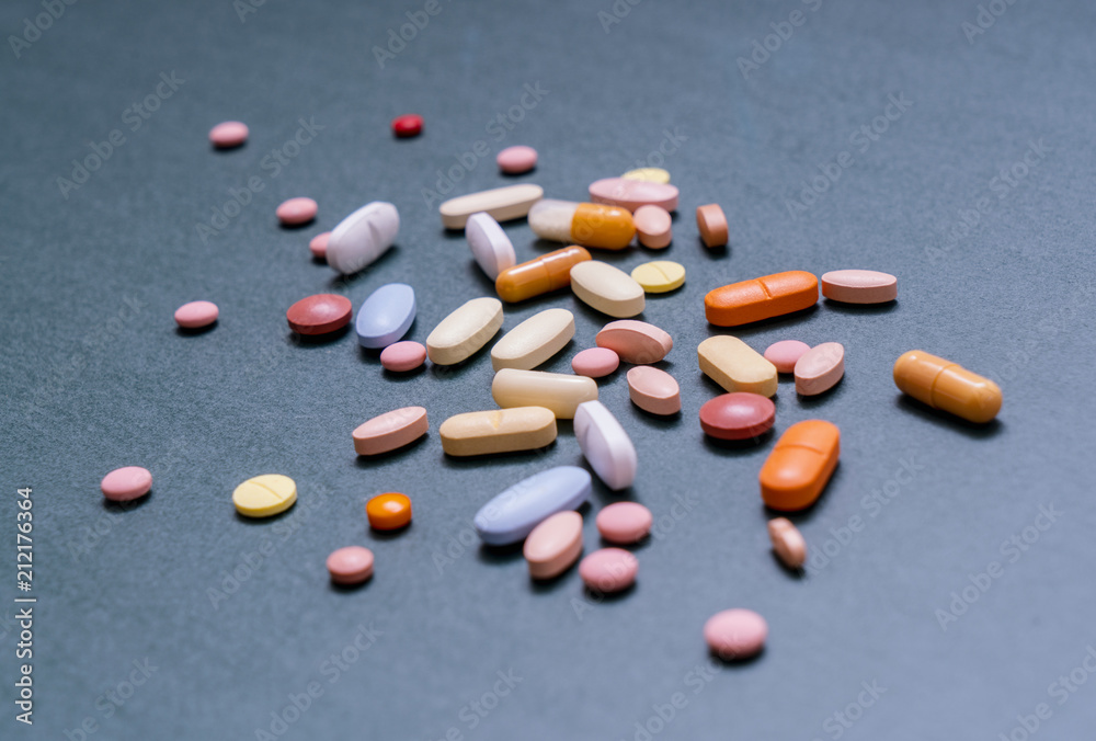 Pile of colorful tablets and capsules pills Pile of colorful tablets and capsules pills