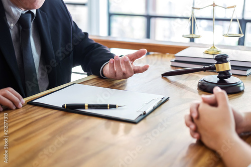 Male lawyer or judge consult having team meeting with client, Law and Legal services concept