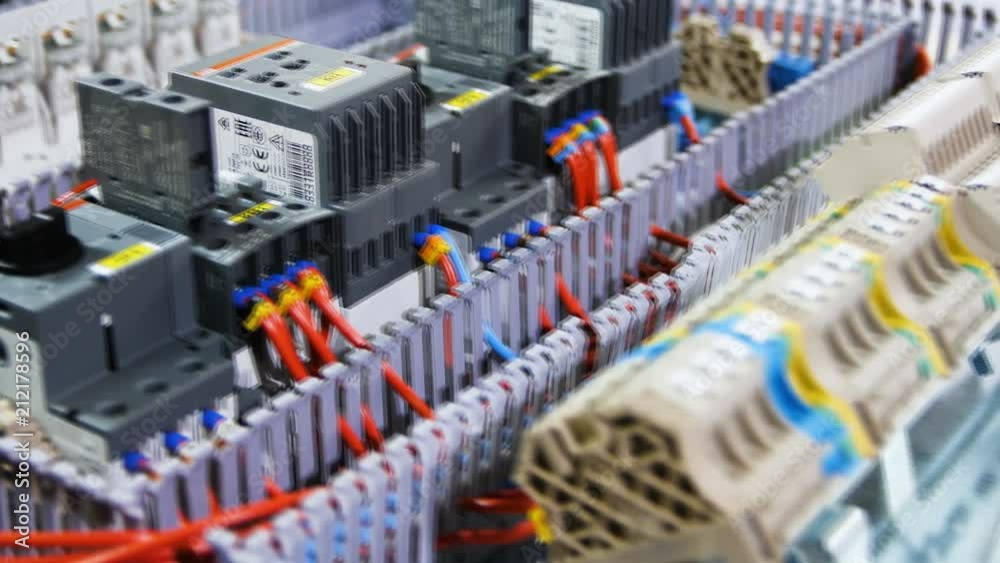 motion past assembled switch board on work table