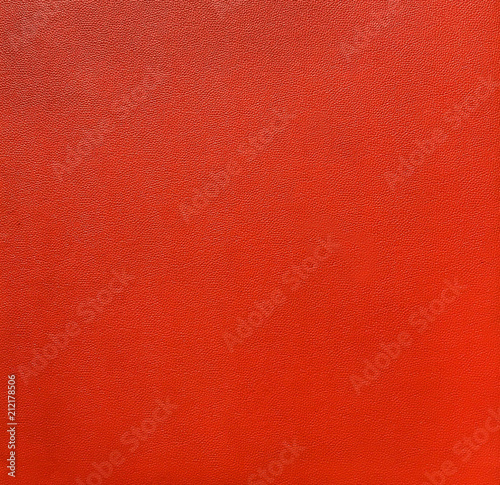 Closeup red synthetic leather texture, wall decoration layer detail background