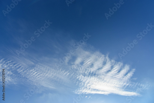 Clouds of cirrocumulus on blue sky photo