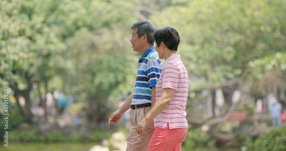 Fototapeta premium Old couple talking together at outdoor park