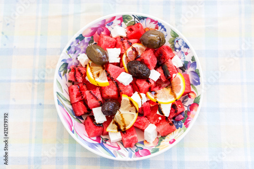 Salad with watermelon  lemon  cheese and olives