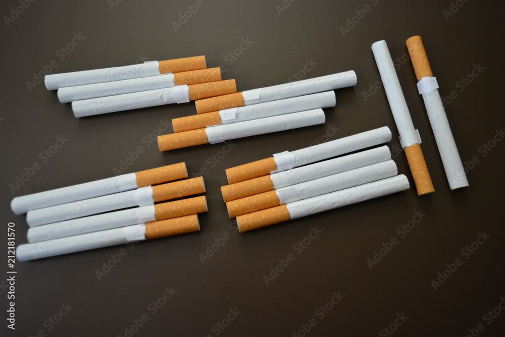 Nicely laid out a lot of cigarettes on the table Nicely laid out a lot of cigarettes on the table