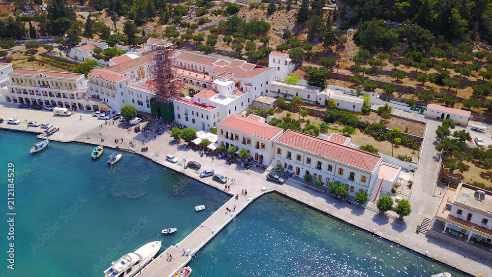 Aerial bird's eye view photo taken by drone from bay and iconic Monastery of Panormitis, Symi island, Dodecanese, Greece