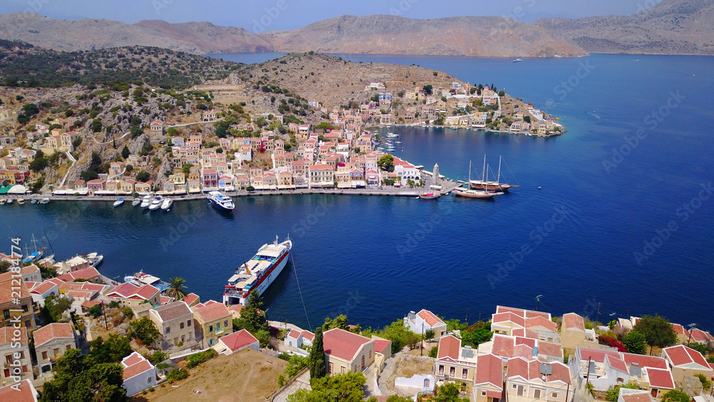 Aerial brid's eye photo taken by drone of Yalos, iconic port of Symi island, Dodecanese, Greece