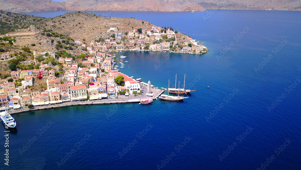 Fototapeta premium Aerial brid's eye photo taken by drone of Yalos, iconic port of Symi island, Dodecanese, Greece