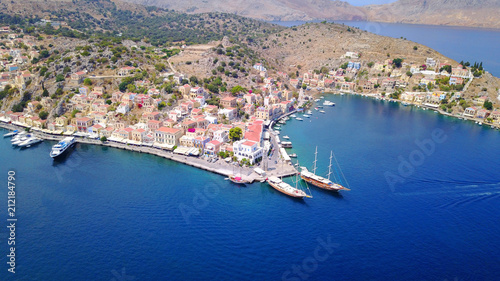 Aerial brid's eye photo taken by drone of Yalos, iconic port of Symi island, Dodecanese, Greece photo