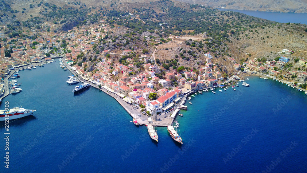 Aerial brid's eye photo taken by drone of Yalos, iconic port of Symi island, Dodecanese, Greece