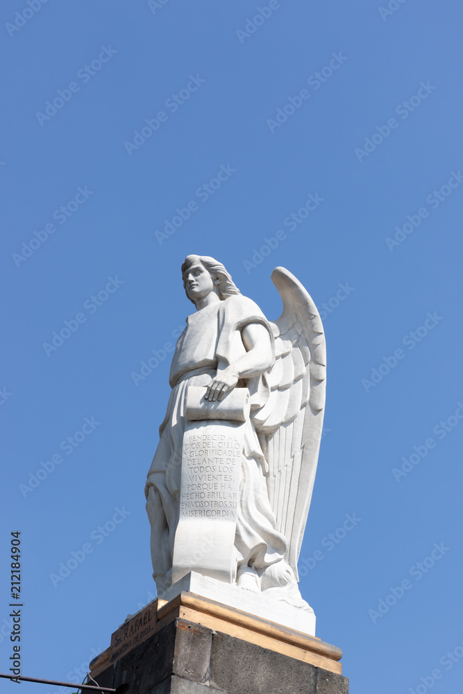 Obraz premium Shrine of Our Lady of Guadalupe. Silhouette of an angel sculpture against a cloudless sky