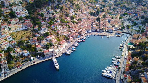 Aerial brid's eye photo taken by drone of Yalos, iconic port of Symi island, Dodecanese, Greece photo